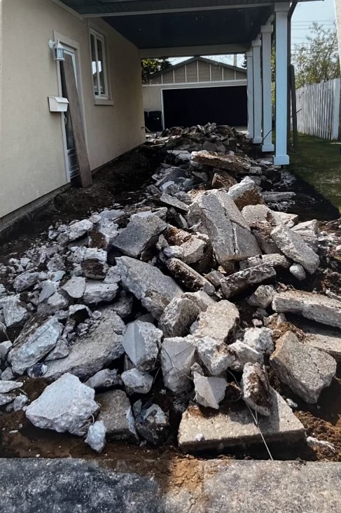 After: concrete fully removed and site cleared by TCR